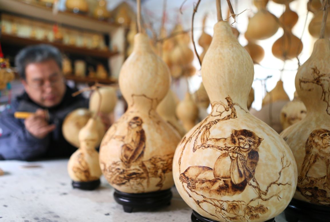 Folk artist Huang Xu makes Monkey King handicrafts in Jimo, China, on Wednesday, January 20. He has created more than 100 pieces.