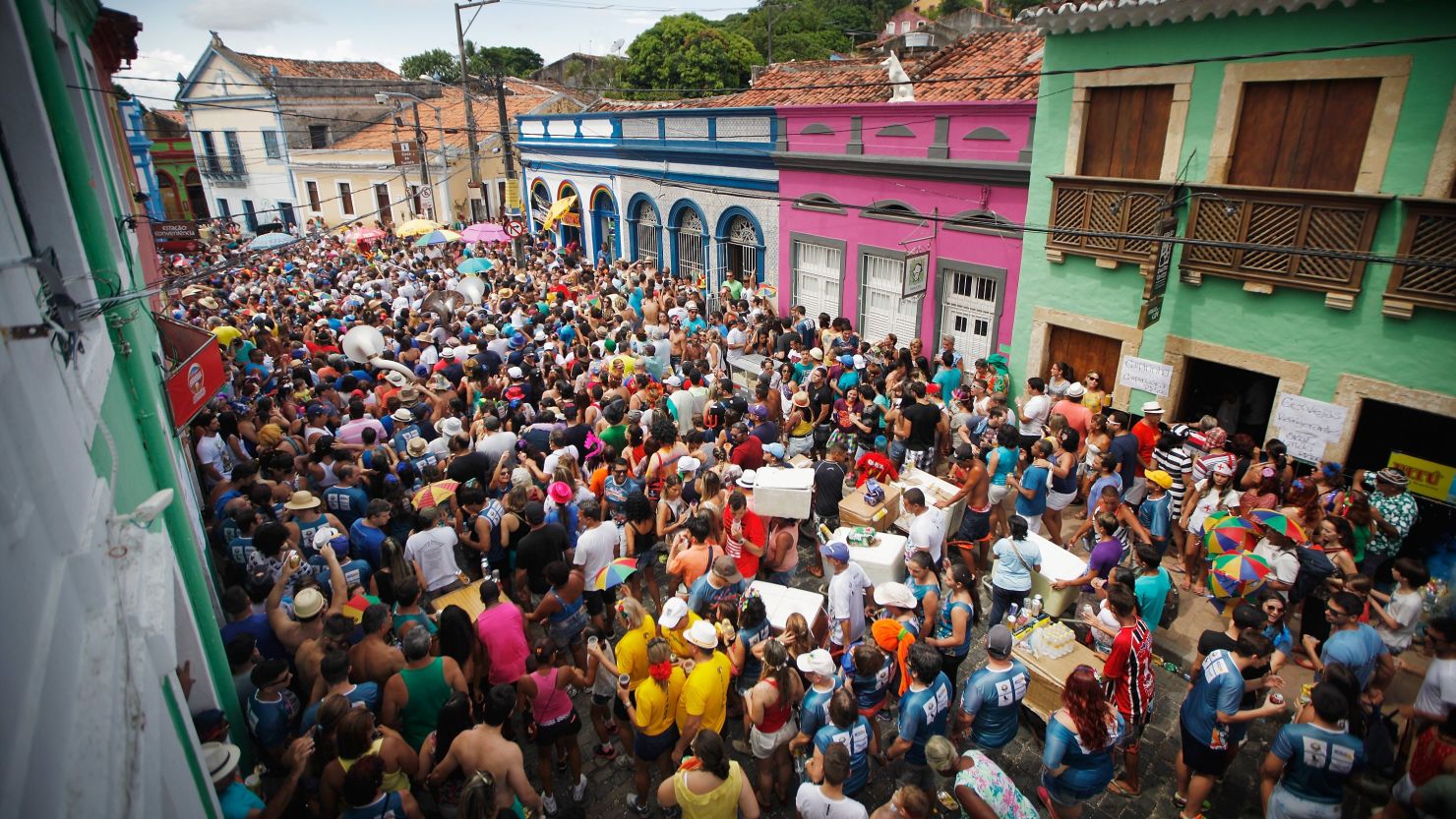 Revelers march during pre-Carnival celebrations.