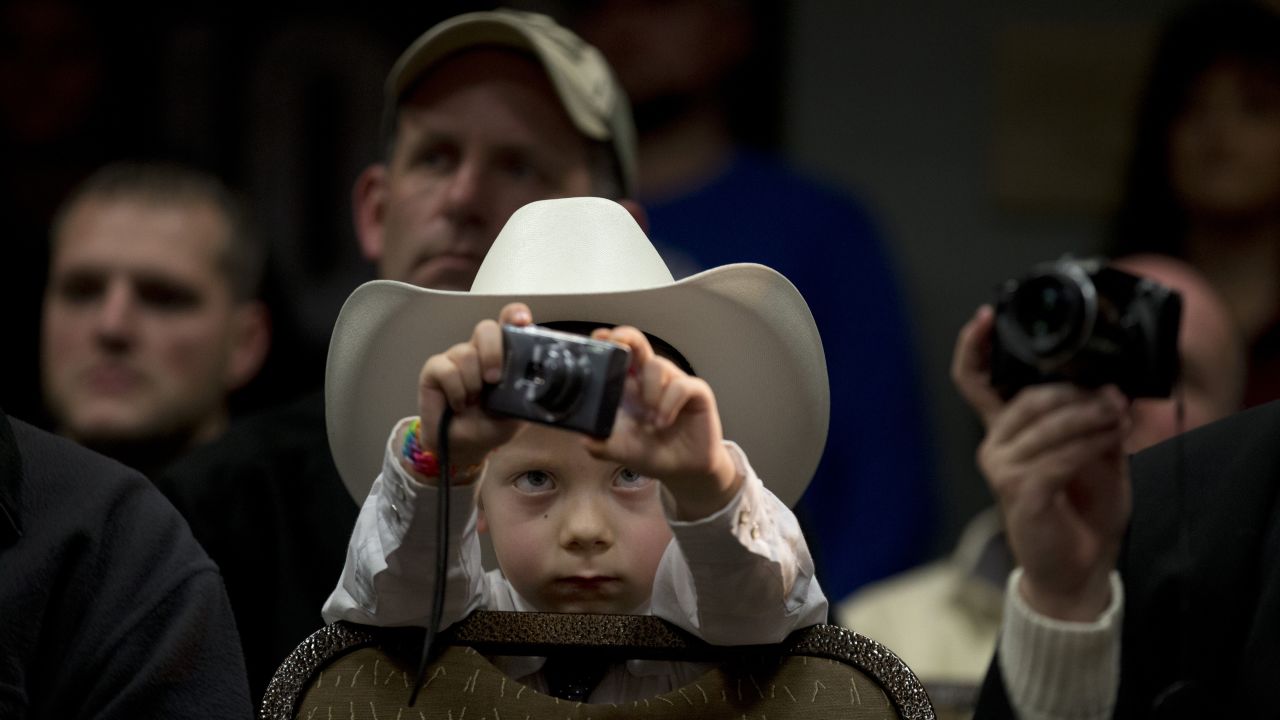 McCoy Wicker, 5, takes pictures of U.S. Sen. Marco Rubio during a presidential campaign rally in Council Bluffs, Iowa, on Saturday, January 30.