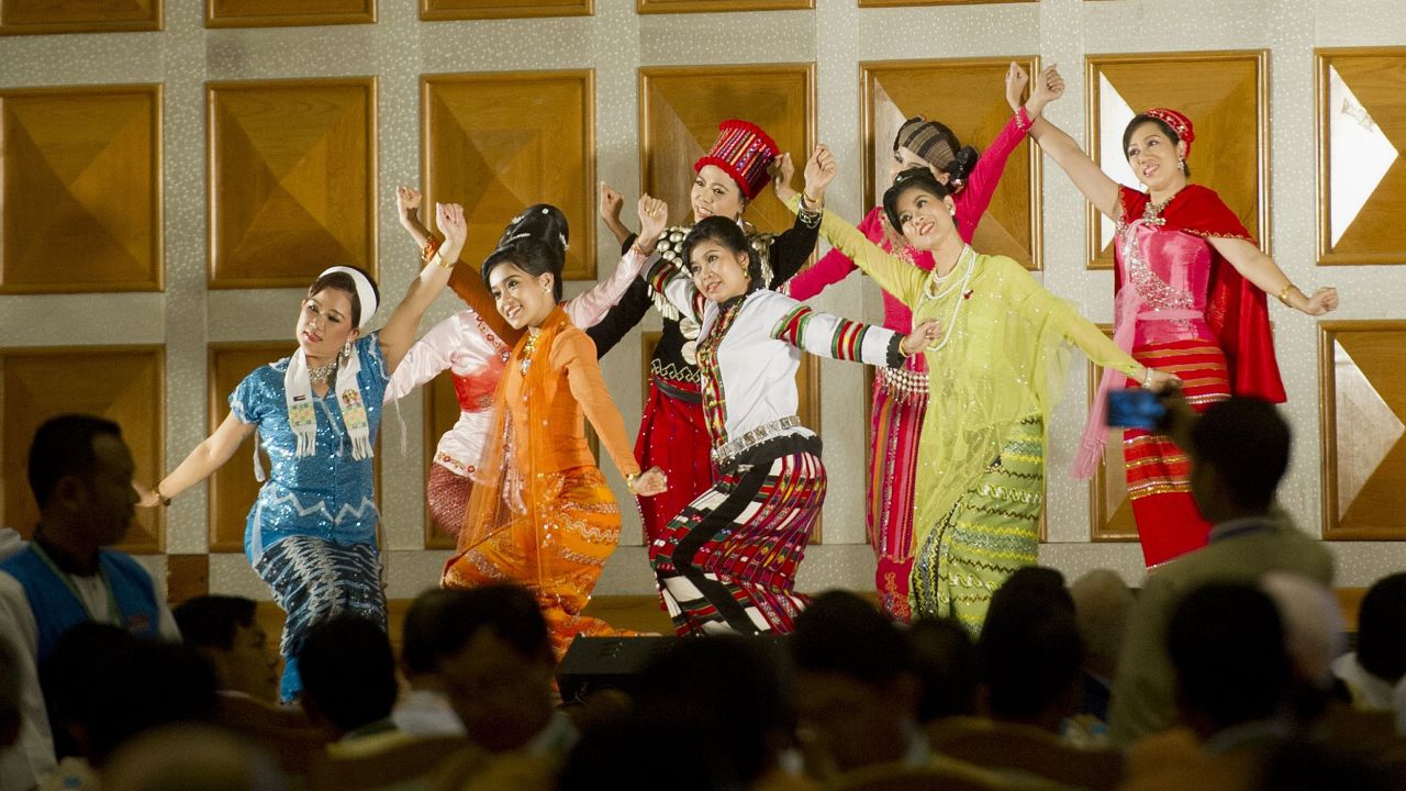 Performers in traditional dress during a farewell ceremony at the Myanmar parliament in Naypyidaw, January 29, 2016.