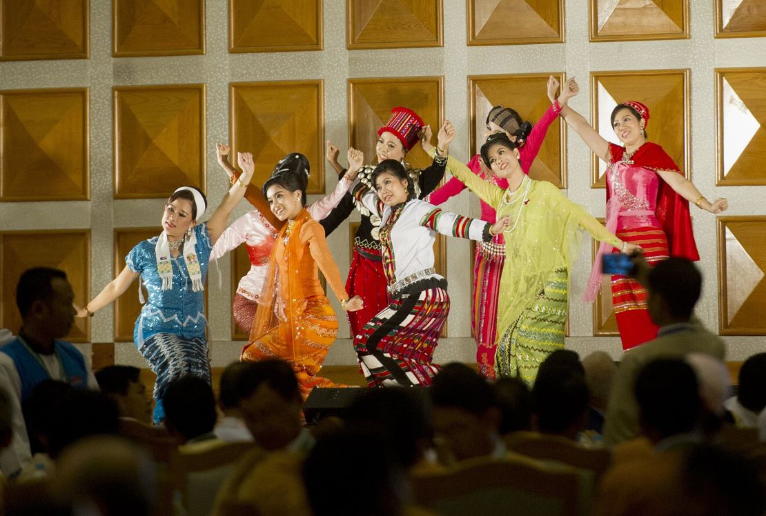 Performers in traditional dress during a farewell ceremony at the Myanmar parliament in Naypyidaw, January 29, 2016.  