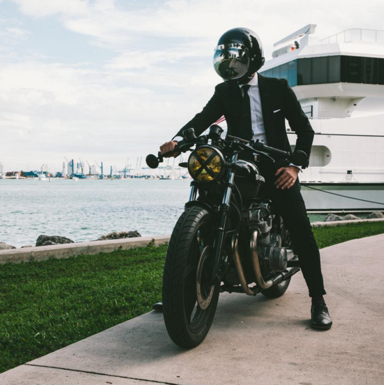 Miami-based Instagrammer Lando Griffin, aka <a href="https://www.instagram.com/thesuitedracer/" target="_blank" target="_blank">The Suited Racer</a>, reviews motorcycles and suits together, providing an outlet for enthusiasts of both. His most recent ride was a classic Suzuki GS550, accompanied by a slim black Tom Ford suit and a 1971 Patek Philippe Calatrava 3445 wristwatch -- a combo straight out of a James Bond film. Dapper gents: take note.