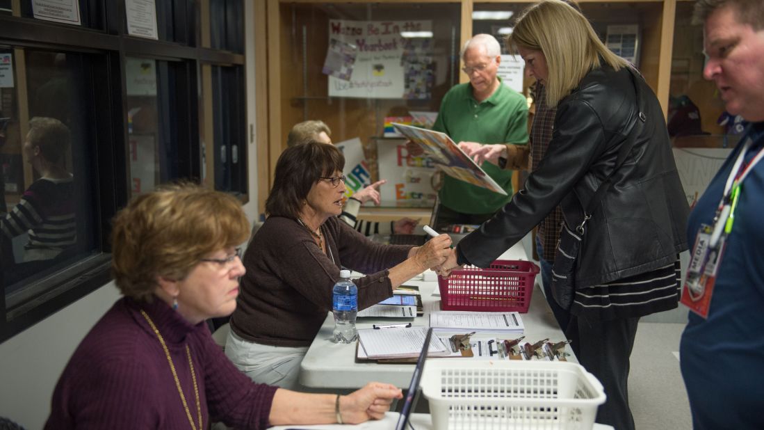 Caucus workers check in voters prior to a Republican Party caucus in Keokuk.
