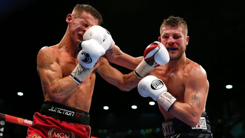 Tommy Martin, left, boxes John Wayne Hibbert during a title fight in London on Saturday, January 30. Hibbert knocked out Martin in the 12th round to retain his super-lightweight titles.