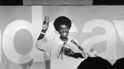 African American educator and U.S. congresswoman Shirley Chisholm stands at a podium and gives the victory sign, circa 1968. (Photo by Pictorial Parade/Getty Images)