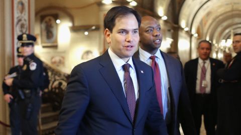 U.S. Sen. Marco Rubio (R-FL) (L) and Sen. Tim Scott (R-SC) walk thorugh the U.S. Capitol February 12, 2014 in Washington, DC.
