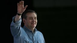 Republican presidential candidate Sen. Ted Cruz waves to Iowa voters while arriving on stage at the Iowa State Fairgrounds on January 31, 2016, in Des Moines, Iowa. 