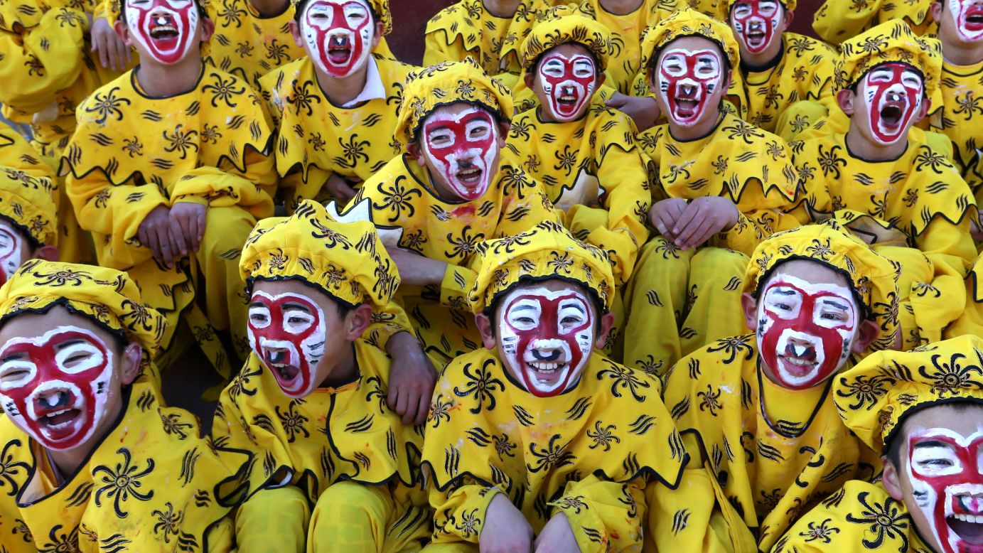 Children dressed up as the Monkey King perform during an art fair in Beijing on February 1.