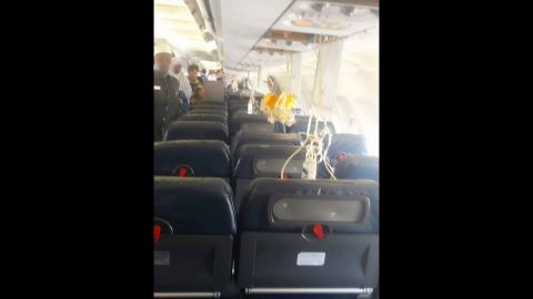 Oxygen masks dangle from the plane's ceiling after Tuesday's explosion.