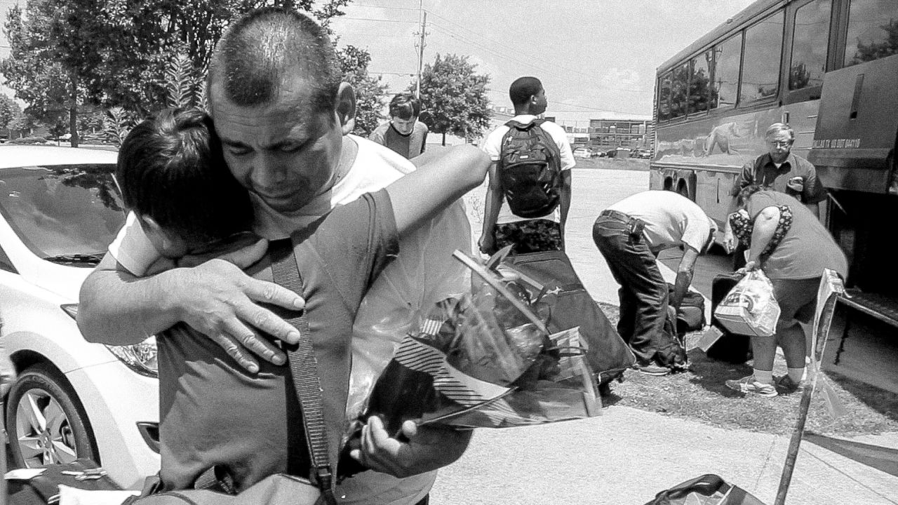 Jesús embraces his father, Pedro, for the first time in 13 years on July 22, 2014. Pedro left his family in Guatemala when Jesus was 1-year-old to find employment in the United States. 