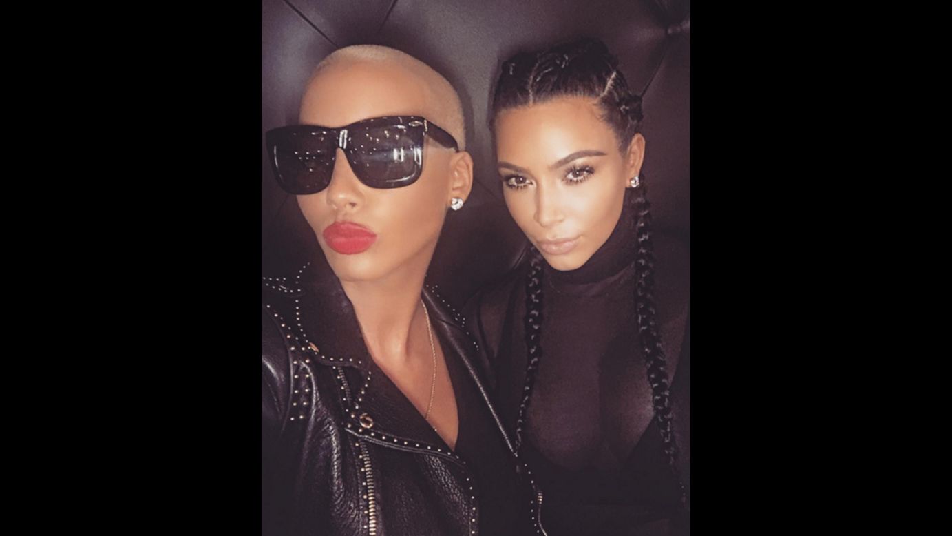Model Amber Rose, left, and television personality Kim Kardashian <a href="http://www.cnn.com/2016/02/02/entertainment/kim-kardashian-amber-rose-tea-party-tweet-feat/index.html" target="_blank">take a selfie together</a> on Tuesday, February 2. It came a few days after their husbands, Wiz Khalifa and Kanye West, got into a much-publicized Twitter argument.