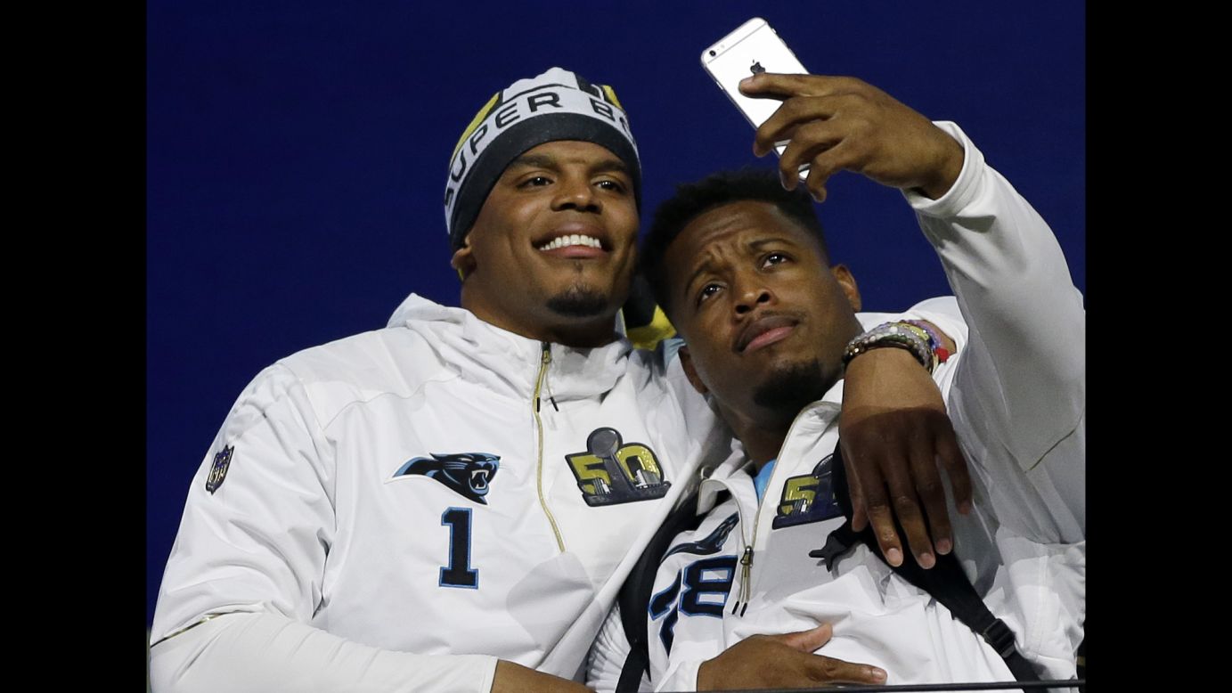 Carolina Panthers running back Jonathan Stewart snaps a photo with quarterback Cam Newton during a Super Bowl event in San Jose, California, on Monday, February 1. The Panthers will play Denver on February 7.