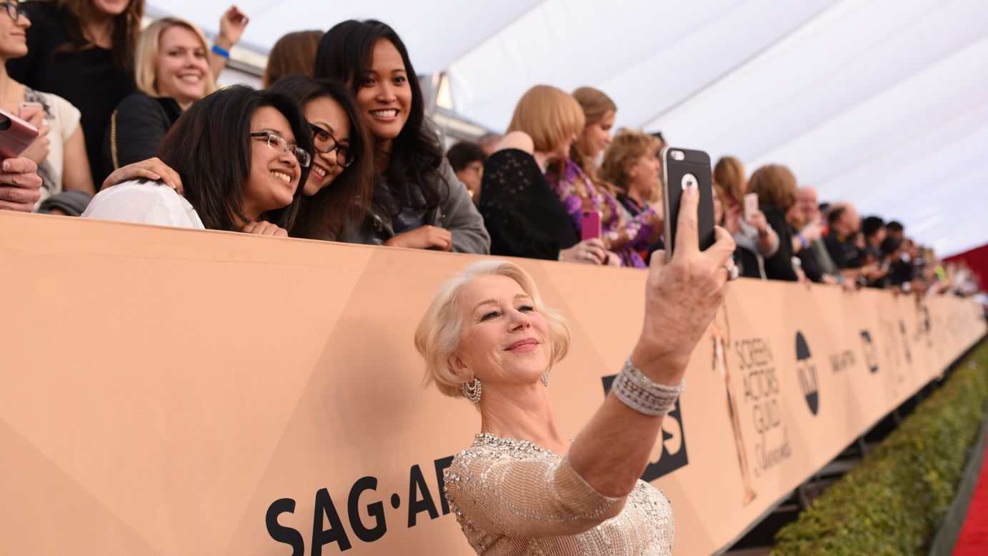 Actress Helen Mirren takes selfies with fans Saturday, January 30, as she walks on <a href="http://www.cnn.com/2016/01/30/entertainment/gallery/sag-red-carpet-2016/index.html" target="_blank">the red carpet</a> before the Screen Actors Guild Awards.