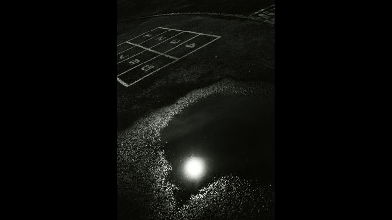 This 1965 print shows a streetlight reflected in a puddle on a playground. After Draper died in 2002, his sister, Nell Draper-Winston, worked to bring attention to his life and career. The first major retrospective of his work was held in 2014.   
