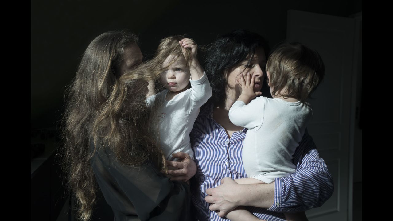 Veronique and Anne pose with their twins, Angele and Lucien, in Brest, France. The same-sex couple had to travel to Belgium to get the in-vitro fertilization they couldn't get in France, said photographer Vincent Gouriou.