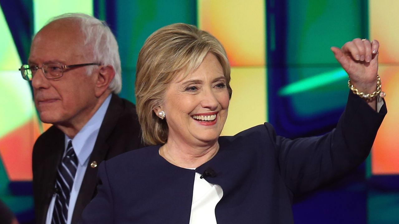 LAS VEGAS, NV - OCTOBER 13:  Democratic presidential candidates Sen. Bernie Sanders (I-VT) (L) and Hillary Clinton walk on the stage at the end of a presidential debate sponsored by CNN and Facebook at Wynn Las Vegas on October 13, 2015 in Las Vegas, Nevada. Five Democratic presidential candidates are participating in the party's first presidential debate.  (Photo by Joe Raedle/Getty Images)