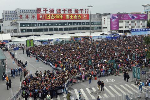 Guangzhou Railway Corp said Tuesday that 38,000 passengers were stuck, but China's People's Daily said the crowd was much bigger -- as many as 100,000.