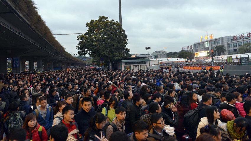 This picture taken on February 1, 2016 shows huge queues outside Guangzhou railway station in Guangzhou, in southern China's Guangdong province.  Tens of thousands of Lunar New Year travelers in China were stranded on February 2 at a station in Guangzhou, state media said, after snow and ice elsewhere disrupted the world's largest annual human migration.