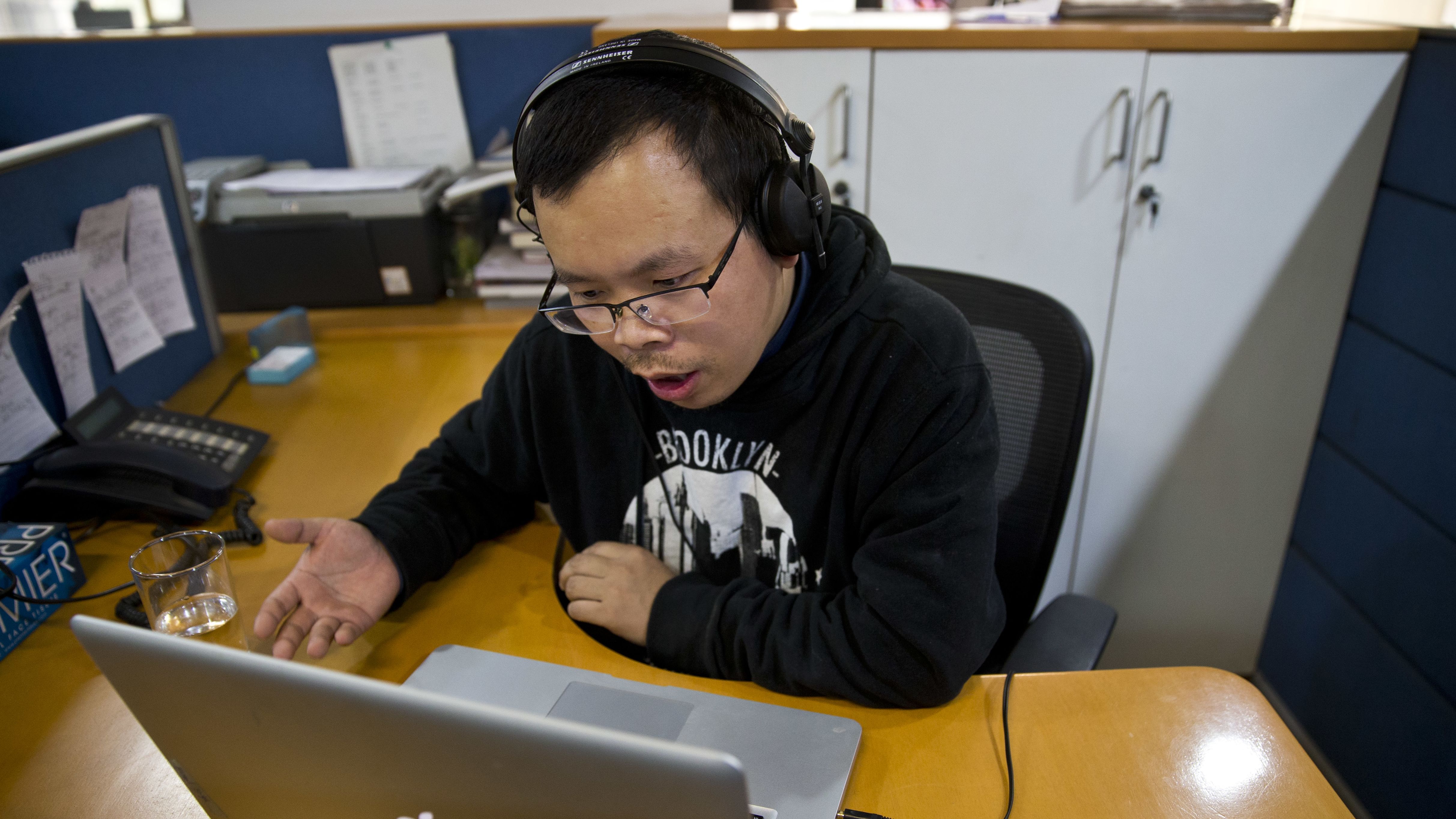 Chinese journalist Li Xin talks to an Associated Press reporter over Skype from New Delhi in November.