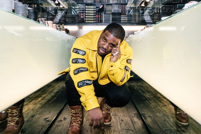 A$AP Ferg dons his custom-made yellow leather jacket with detachable "Ferg" patches and lace-up Timberland Boots. 