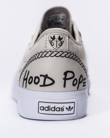 A$AP Ferg's song logo "Hood Pope" is featured on the back of the Traplord Adi-Ease.