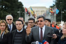 Members of the main Syrian opposition delegation speak outside United Nations offices in Geneva on Tuesday.