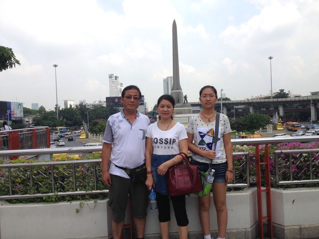 Dong Guangping, left, with his wife Gu Shuhua, and daughter in Bangkok on October 7, 2015 after handing in documents to the UNHCR. 