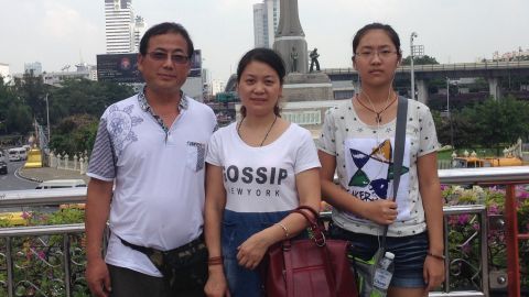 Dong Guangping, left, with his wife Gu Shuhua, and daughter in Bangkok on October 7, 2015 after handing in documents to the UNHCR. 