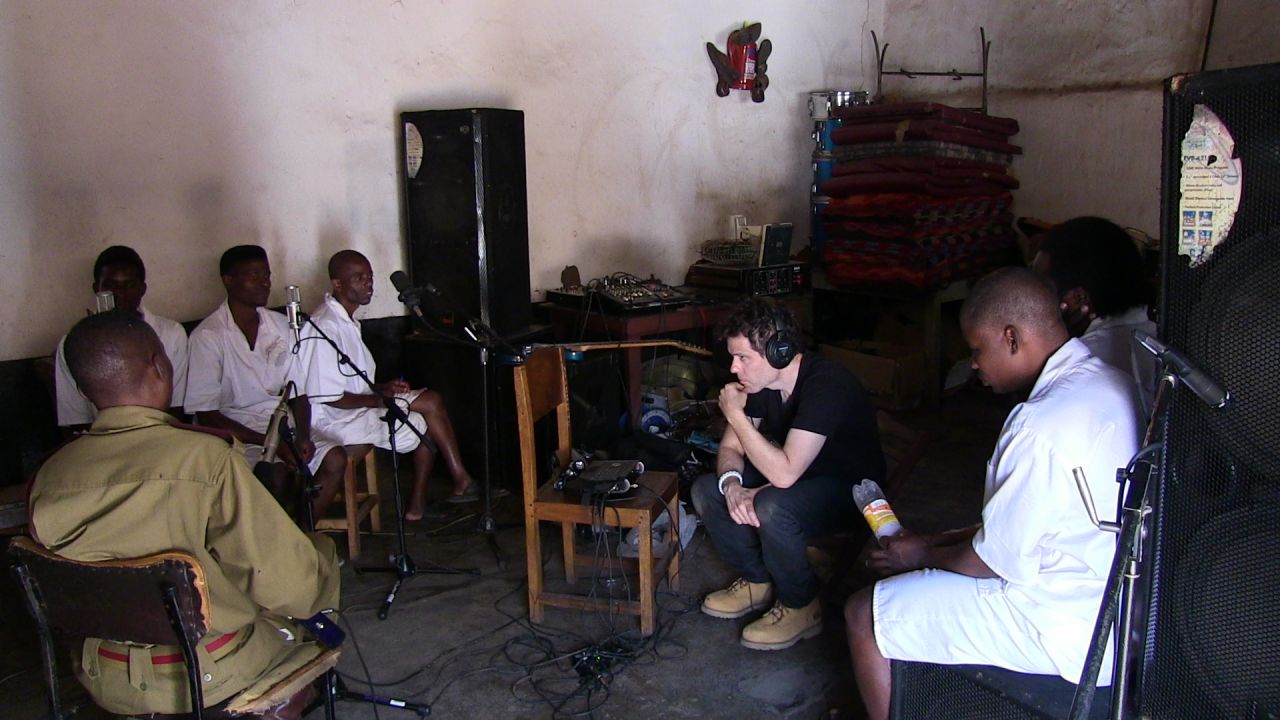 Music producer Ian Brennan was allowed rare access inside the prison along with his wife, Marilena Delli, a filmmaker and photographer who documented the recording process in one of the world's most overburdened jails.<br />"The prison was designed to hold 330 people, and has 2,000 or more at any given time," he says. Brennan recalls that space is so overstuffed, prisoners are forced to sleep on top of each other and head-to-toe, "like sardines."