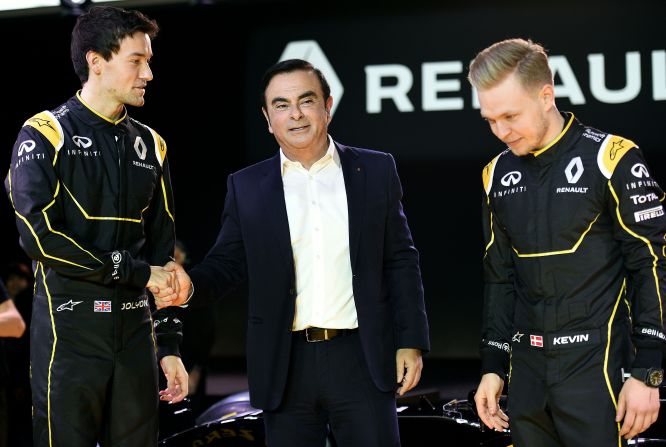 Renault President Carlos Ghosn (center) is placing the hopes of the French car manufacturer's race team in the hands of British rookie Jolyon Palmer (left) and former McLaren driver Kevin Magnussen (right).