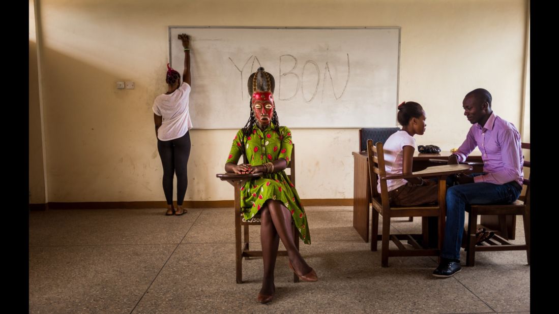 Jaqueline, 32, wears the Baoule mask of a queen. She teaches Portuguese in Accra.