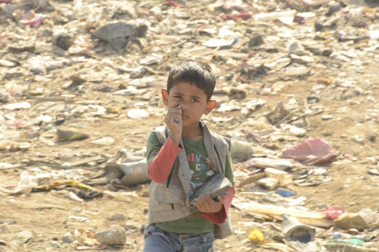 While thousands make their living from the dump, it should be razed and replaced with housing for the neighborhood slum dwellers, one advocate tells CNN.