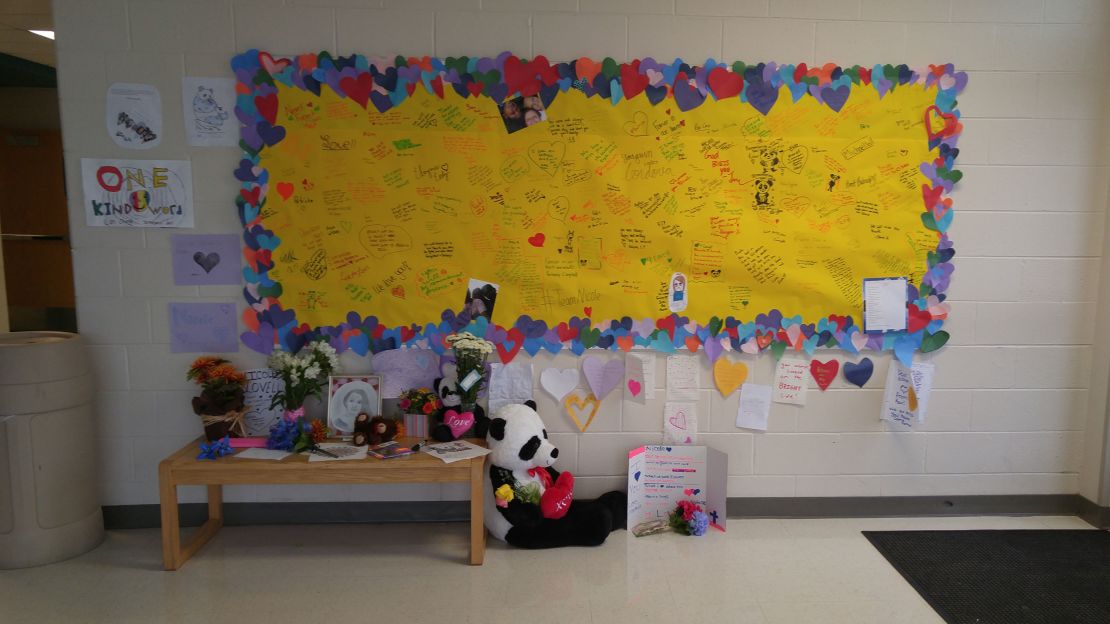 In the seventh-grade wing of Blacksburg Middle School, a memorial has been growing daily as students write remembrances and leave flowers, cards and stuffed animals in her honor. 