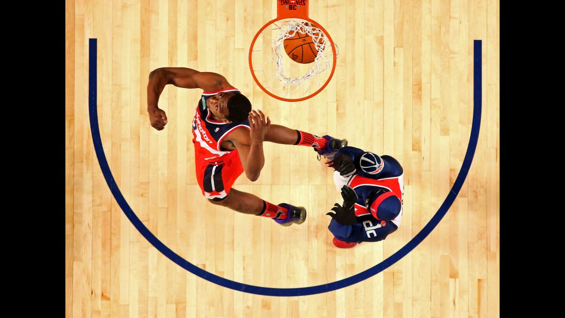<strong>John Wall (2014):</strong> The contest took on an unusual team format this year, with "battle rounds" pitting one Eastern Conference dunker against one Western Conference dunker. At the end, the fans voted on John Wall as the "Dunker of the Night." He had jumped over Wizards mascot G-Man for a ferocious reverse dunk. They celebrated with the "Nae Nae" dance.