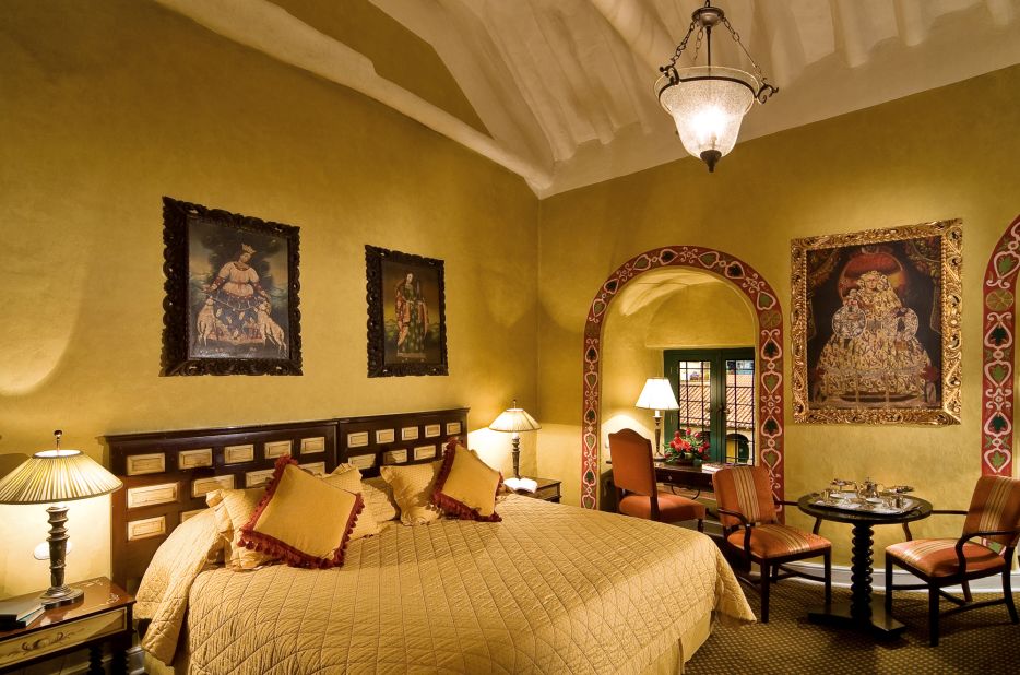 Rooms are decorated with religious art and clustered around a tranquil central courtyard.