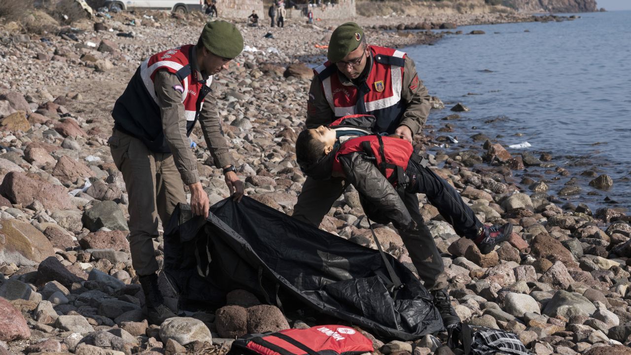 A police officer holds the lifeless body of a boy near Ayvacik, Turkey, on Saturday, January 30. At least 33 people, including five children, were reportedly killed when a boat carrying migrants to Greece <a href="http://www.cnn.com/2016/01/30/world/europe-migrant-deaths/" target="_blank">capsized off the Turkish coast.</a> Greece is a major destination for those trying to escape war and poverty and get into Europe.