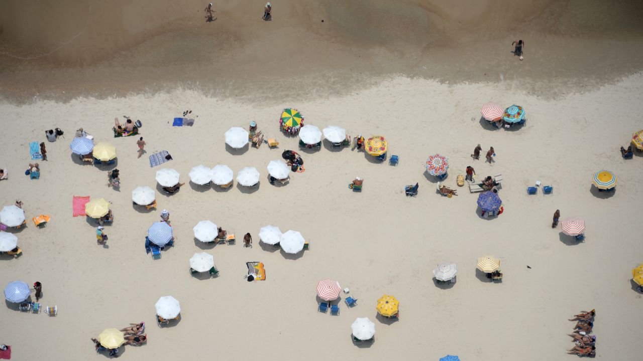 Brazilians enjoy the Copacabana beach in Rio de Janeiro on Wednesday, February 3.