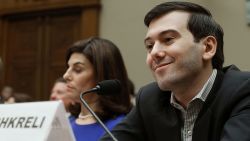 WASHINGTON, DC - FEBRUARY 04: Martin Shkreli, former CEO of Turing Pharmaceuticals LLC., smiles while flanked by Nancy Retzlaff, chief commercial officer for Turing Pharmaceuticals LLC., during a House Oversight and Government Reform Committee hearing on Capitol Hill, February 4, 2016 in Washington, DC. Shkreli invoked his 5th Amendment right not to testify to the committee that is examining the prescription drug market. (Photo by Mark Wilson/Getty Images) *** BESTPIX ***