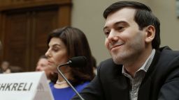 WASHINGTON, DC - FEBRUARY 04: Martin Shkreli, former CEO of Turing Pharmaceuticals LLC., smiles while flanked by Nancy Retzlaff, chief commercial officer for Turing Pharmaceuticals LLC., during a House Oversight and Government Reform Committee hearing on Capitol Hill, February 4, 2016 in Washington, DC. Shkreli invoked his 5th Amendment right not to testify to the committee that is examining the prescription drug market. (Photo by Mark Wilson/Getty Images) *** BESTPIX ***