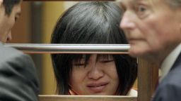 Dr Hsiu Ying "Lisa" Tseng cries during her arraignment, flanked by attornies, Edward Welbourn, left, and Alan Stokke, Friday, March 16, 2012 in Los Angeles. Tseng, a California doctor, has pleaded not guilty to charges of second-degree murder in the prescription drug overdose deaths of three patients. (AP Photo/Nick Ut)