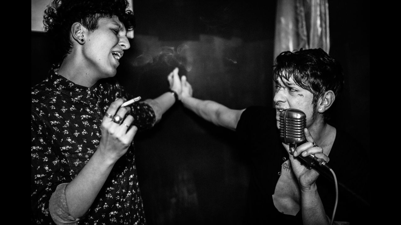 A young Italian named Dario, right, performs at a party in Rome in 2015. Photographer Gianluca Abblasio has been documenting the aspiring rock star's life in a photo series called "I Am Dario."