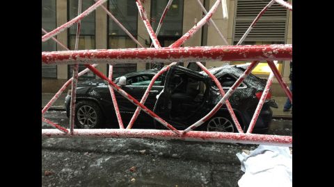 The crane collapsed on a Manhattan street Friday morning in snowy conditions.