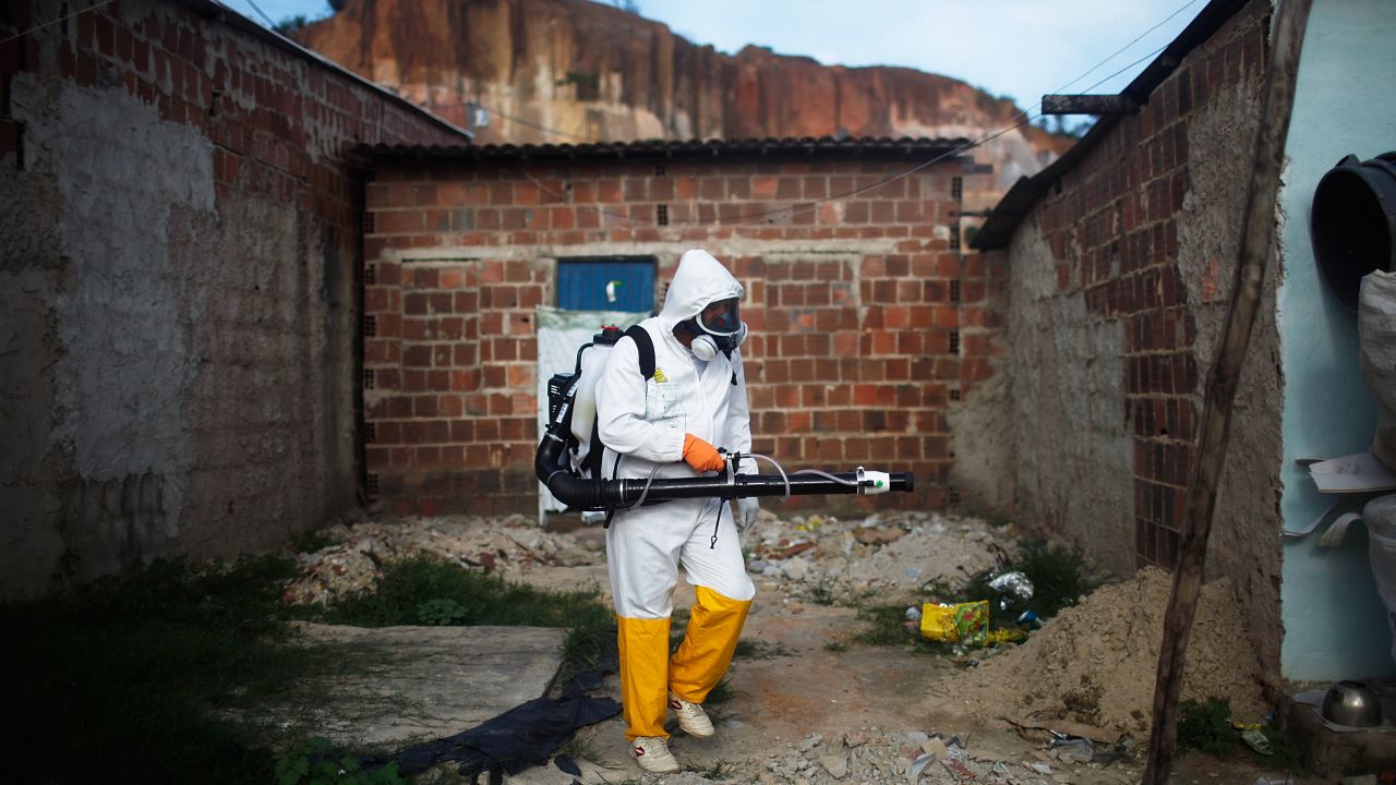 RECIFE, BRAZIL - FEBRUARY 04: A city worker fumigates in an effort to eradicate the mosquito which transmits the Zika virus on February 4, 2016 in Recife, Pernambuco state, Brazil. Officials say as many as 100,000 people may have already been exposed to the Zika virus in Recife, which is being called the epicenter of the crisis, although most never develop symptoms. Tourists are arriving in the city for its famed Carnival celebrations which begin tomorrow. (Photo by Mario Tama/Getty Images)