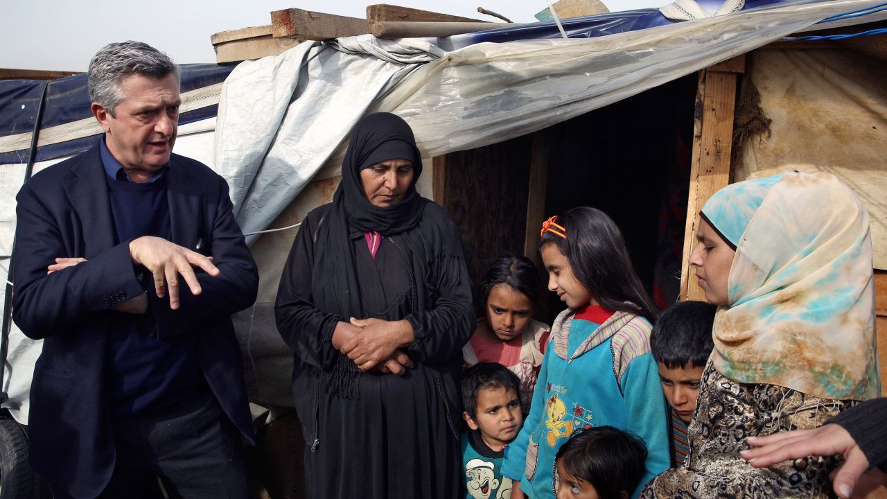 U.N. High Commissioner for Refugees Filippo Grandi speaks with a Syrian family outside their tent in Saadnayel, Lebanon, in the Bekaa Valley, on January 22.