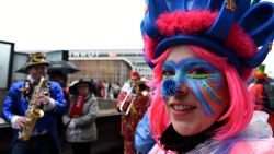 A woman in fancy dress and with her face painted celebrates at Cologne's carnival, on February 4, 2016.