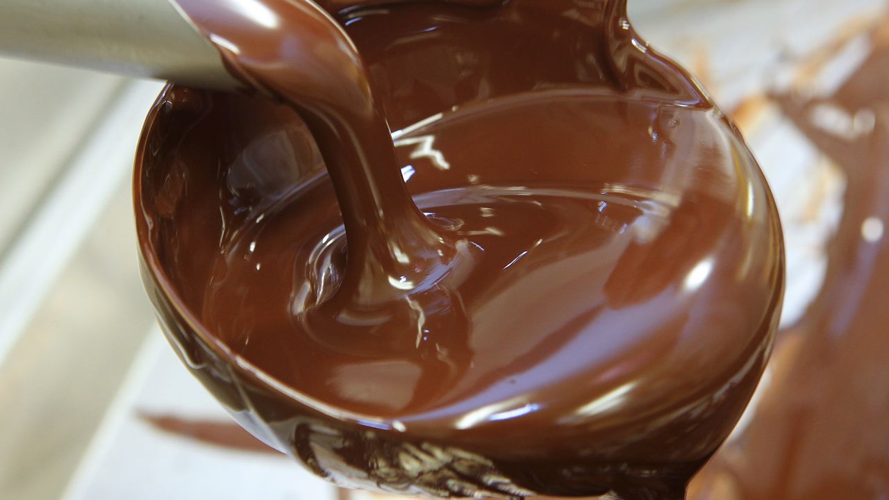 Melted chocolate is poured on October 28, 2011 in Troyes, at the workshop of Pascal Caffet, awarded "Meilleur Ouvrier de France" (best craftsman of France) in the category pastrymaking, chocolate maker of French gourmet food company Fauchon. AFP PHOTO FRANCOIS NASCIMBENI (Photo credit should read FRANCOIS NASCIMBENI/AFP/Getty Images)