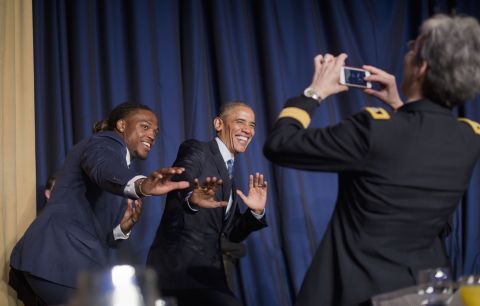 University of Alabama football player and Heisman Trophy winner Derrick Henry and President Barack Obama strike a "Heisman pose" during the <a href="http://www.cnn.com/2016/02/04/politics/obama-national-prayer-breakfast/" target="_blank">National Prayer Breakfast</a> in Washington on Thursday, February 4. The annual event brings together U.S. and international leaders and figures from different parties and religions for an hour devoted to faith.