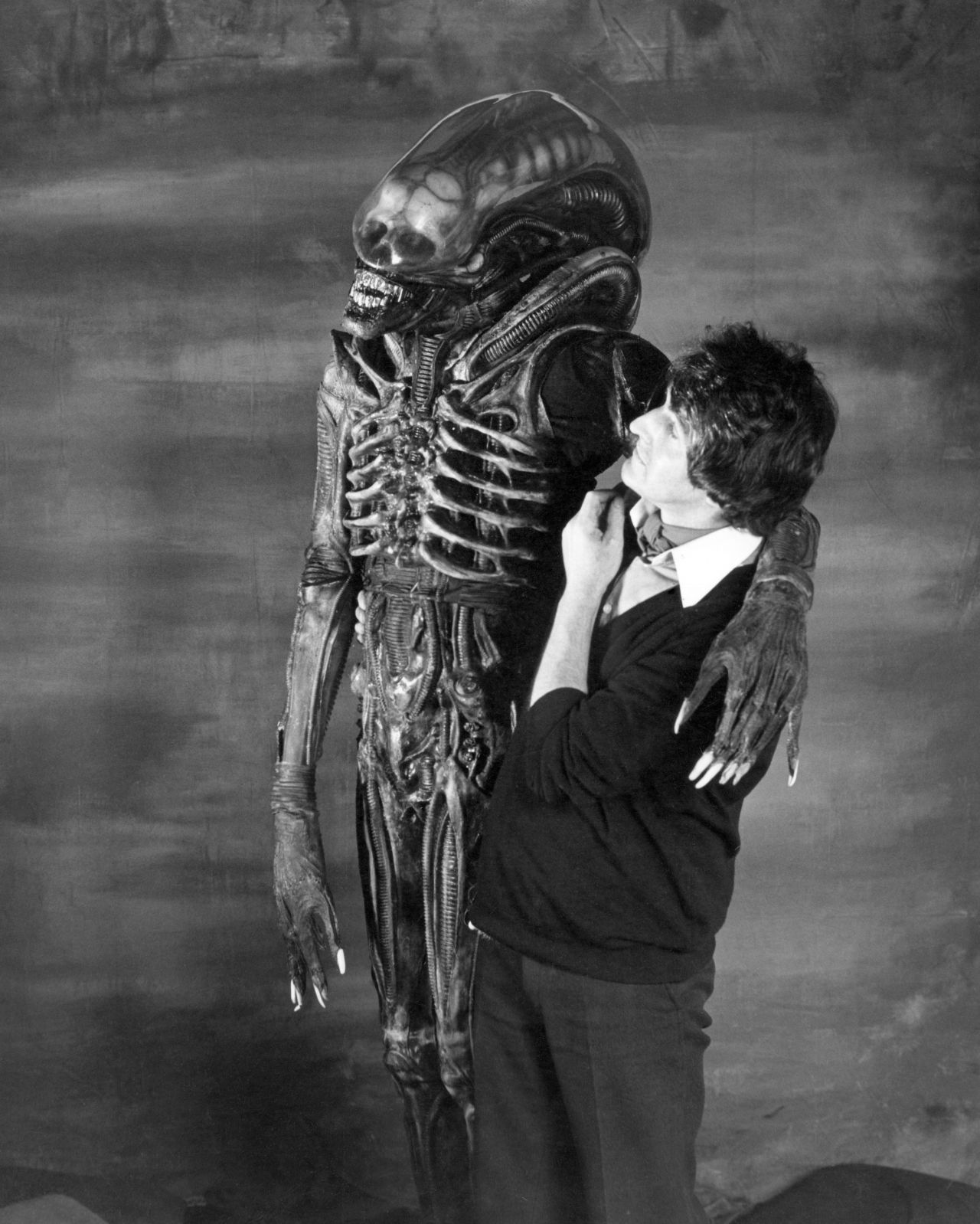 Badejo, seen here with dresser John Birkinshaw inside Bray Studios. The design for the alien's costume was the brainchild of H.R. Giger, who created concepts for many of the sets. Made from latex, the fitting process was long and arduous, not to mention uncomfortable for Badejo.
