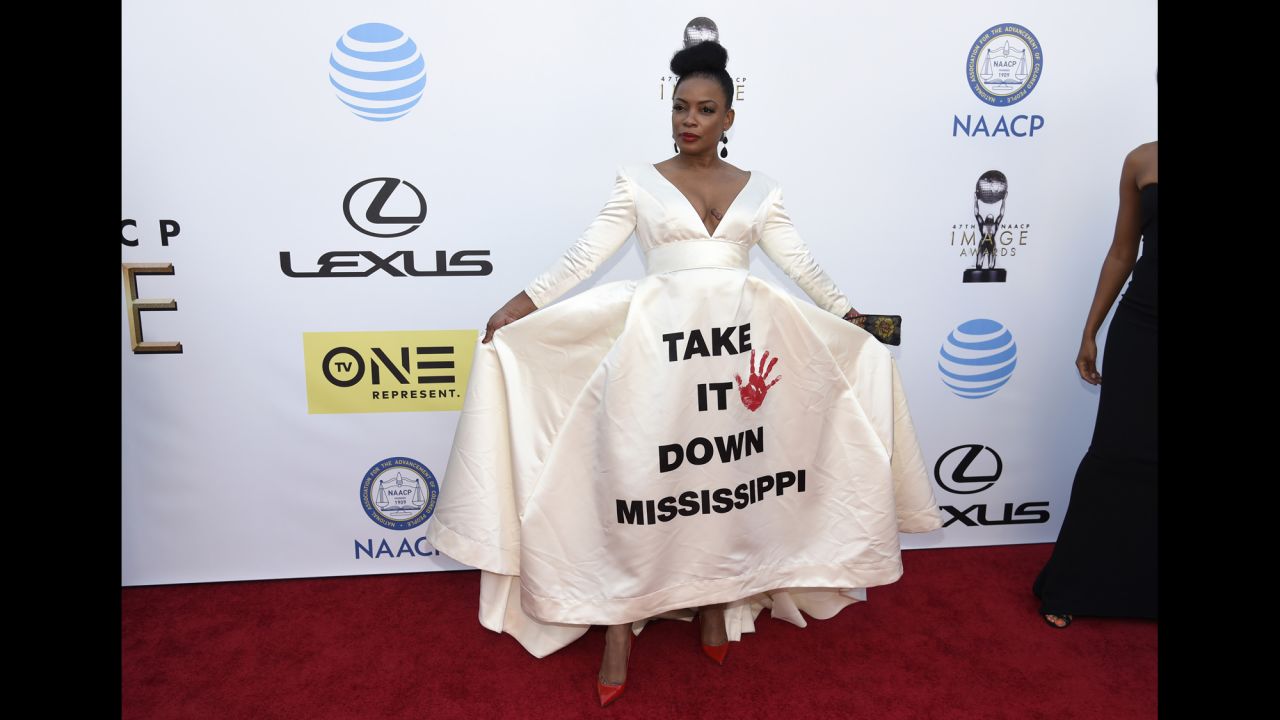 Aunjanue Ellis arrives at the 47th NAACP Image Awards on Friday, February 5. The "Quantico" star wore a white dress emblazoned with the phrase "Take It Down Mississippi," a reference to ongoing debate over the state flag, the last in the country to incorporate the Confederate battle emblem.