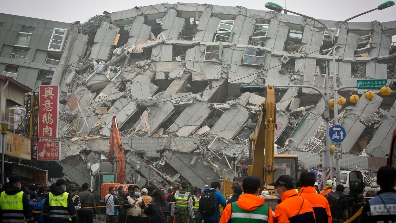 Rescue personnel search for survivors at the site of a collapsed building, the Weiguan Jinlong residential complex, in Tainan on February 6.
